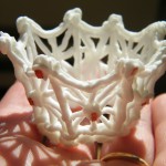 Close up of royal icing crown with sugar jewels.